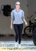 Rosie Huntington-Whiteley looks sporty in a grey pullover jacket and black leggings while out running errands in Los Angeles