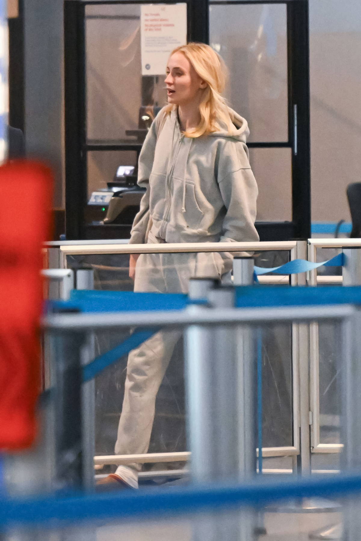 Sophie Turner keeps a low profile in a hoodie as as she arrives at JFK airport in New York City