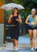 Suri Cruise braves the rain while out with a friend in New York City
