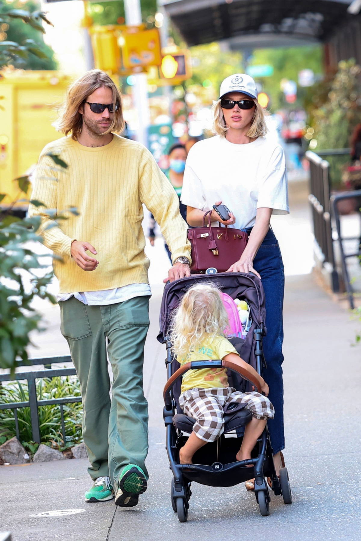 Elsa Hosk looks good in a crisp white tee and blue jeans while out for a family stroll in New York City