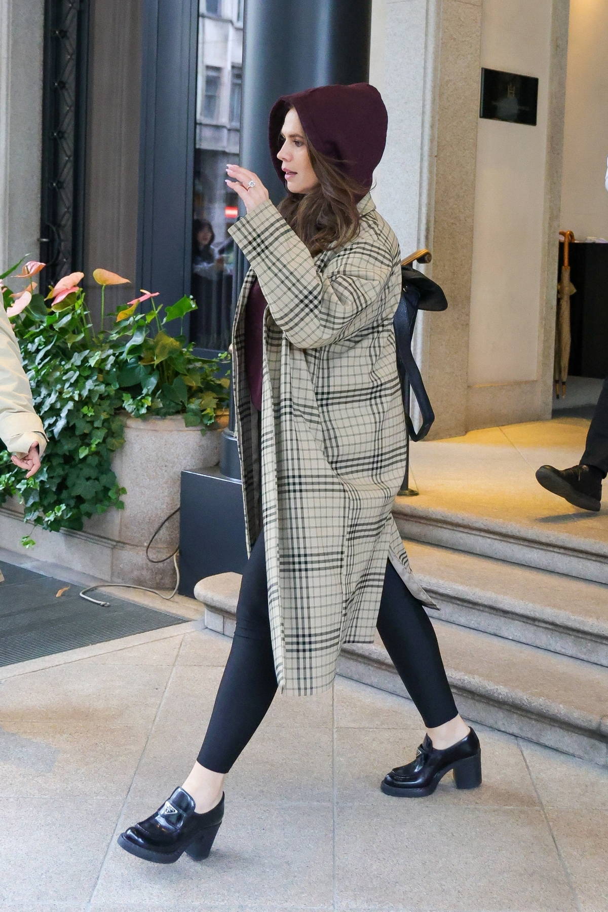 Hayley Atwell keeps a low profile in a hoodie and plaid coat as she leaves her hotel seen in Milan, Italy