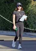Lucy Hale dressed sporty in a black tee and leggings as she hits the gym in Los Angeles