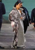 Kim Kardashian looks fashionable in floor-length fur coat as she attends Paris Hilton's concert at the Hollywood Palladium in Los Angeles