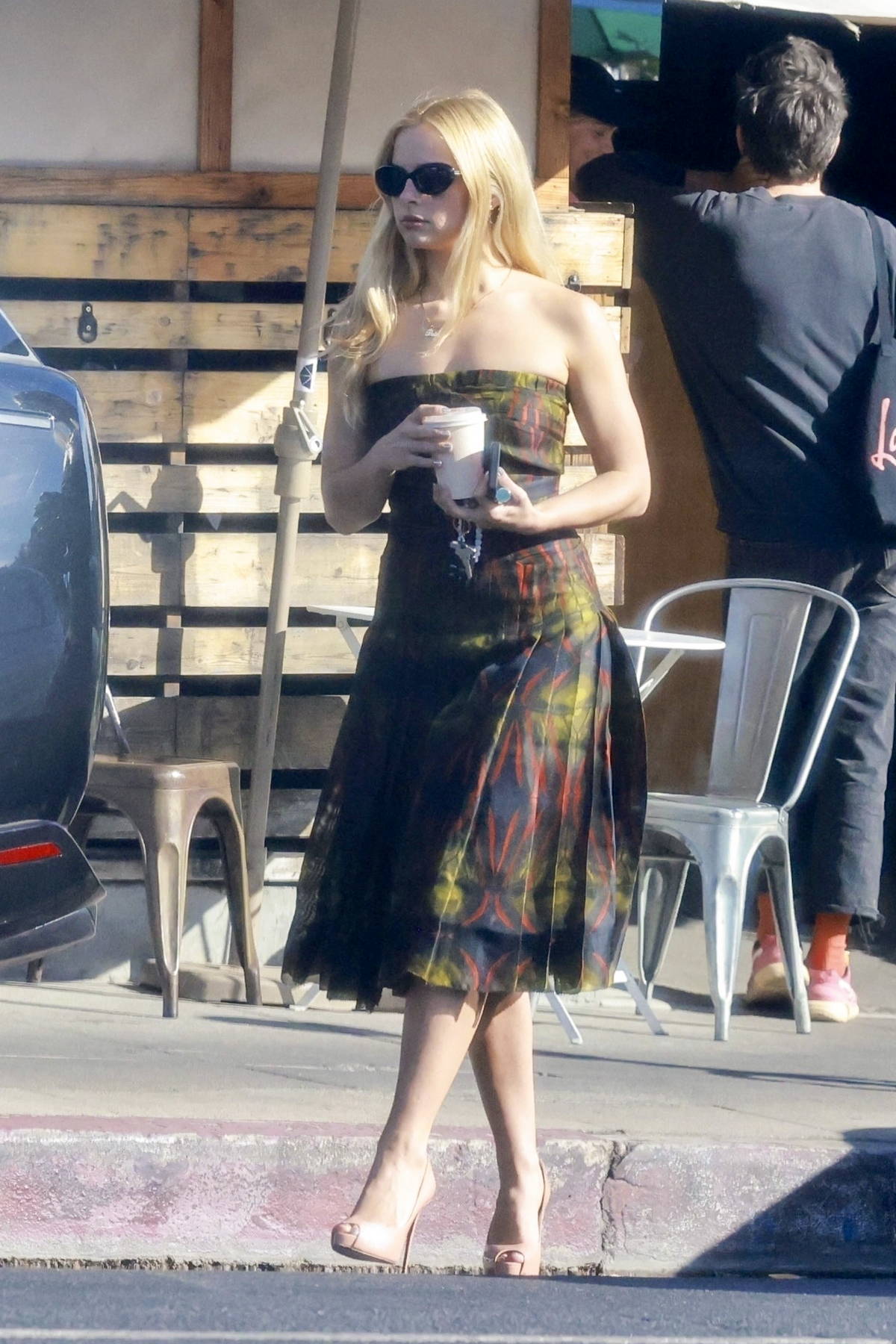 Addison Rae looks striking in blonde hair and strapless dress during a coffee run in Los Feliz, California