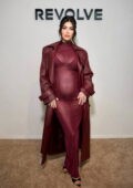 Megan Fox debuts her baby bump in a see-through burgundy dress while shopping at Revolve's Holiday Shop in Los Angeles